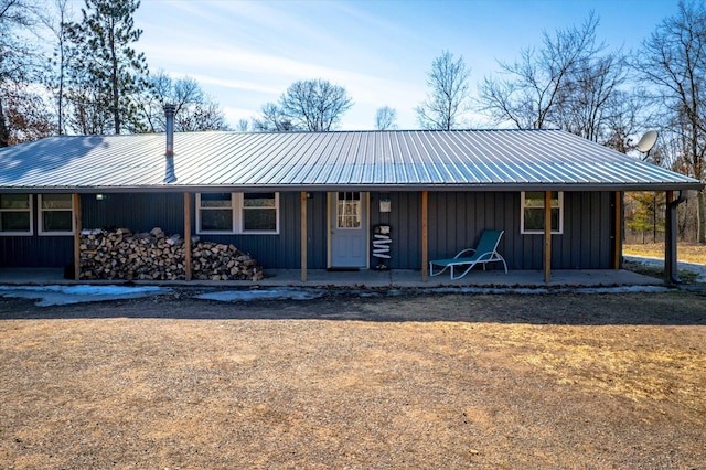 view of front of property featuring metal roof, board and batten siding, and a porch