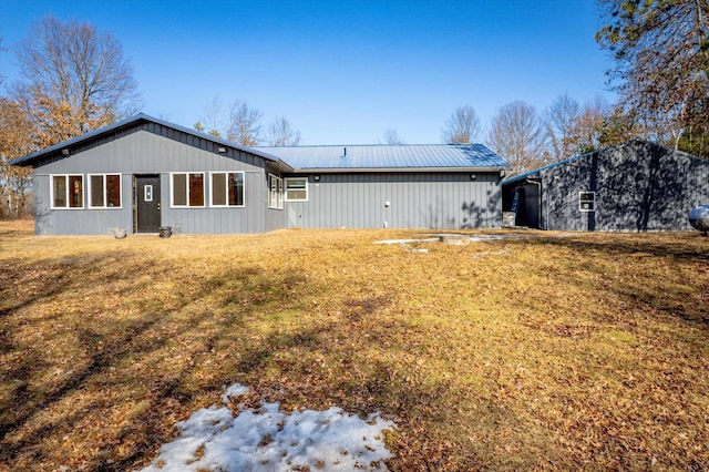 back of house with metal roof