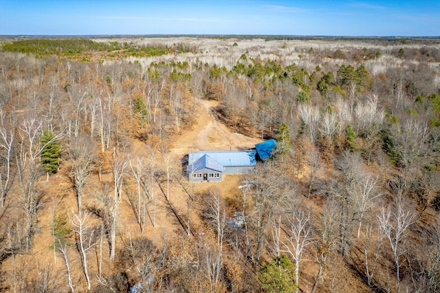 drone / aerial view featuring a view of trees