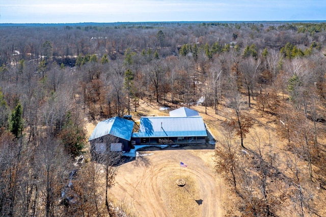 birds eye view of property with a forest view