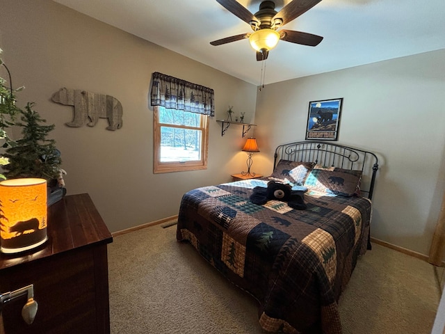 carpeted bedroom featuring a ceiling fan and baseboards