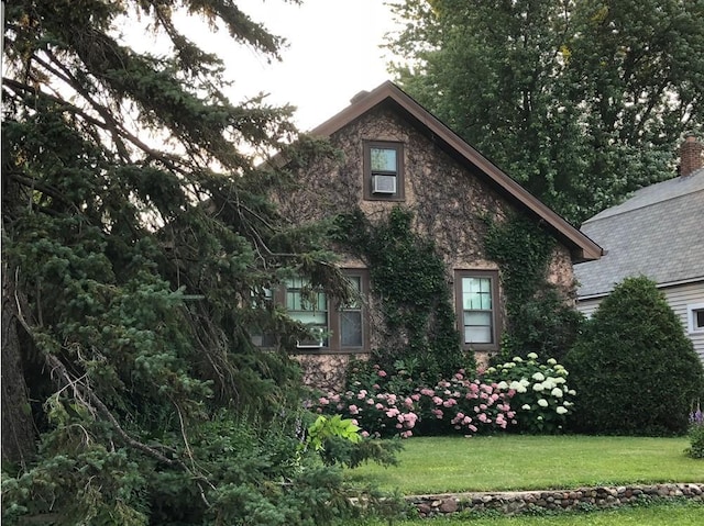 view of home's exterior featuring a lawn