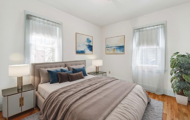 bedroom with light wood finished floors