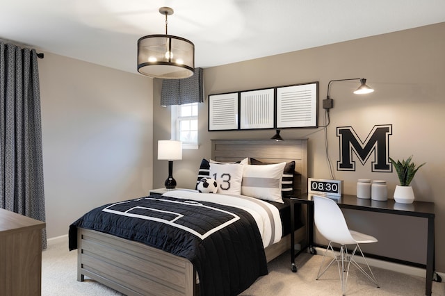 bedroom with baseboards and carpet floors