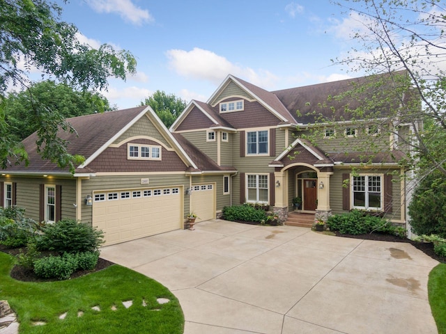 view of front of property featuring an attached garage and driveway