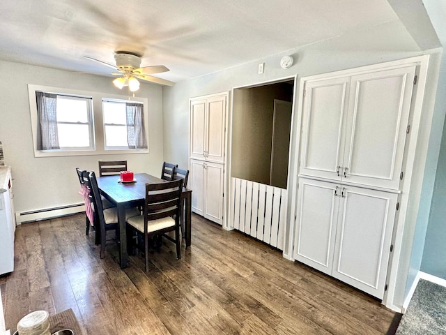 dining area featuring ceiling fan, dark wood-type flooring, and baseboard heating