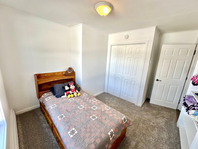 bedroom featuring a closet, carpet flooring, and baseboards