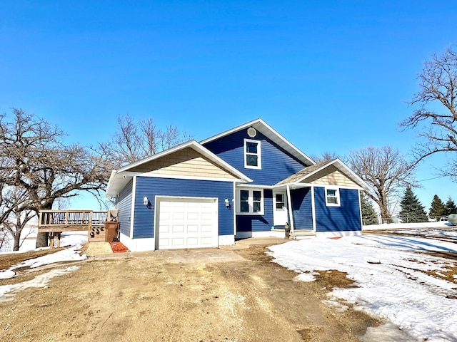 view of front facade with a garage and dirt driveway