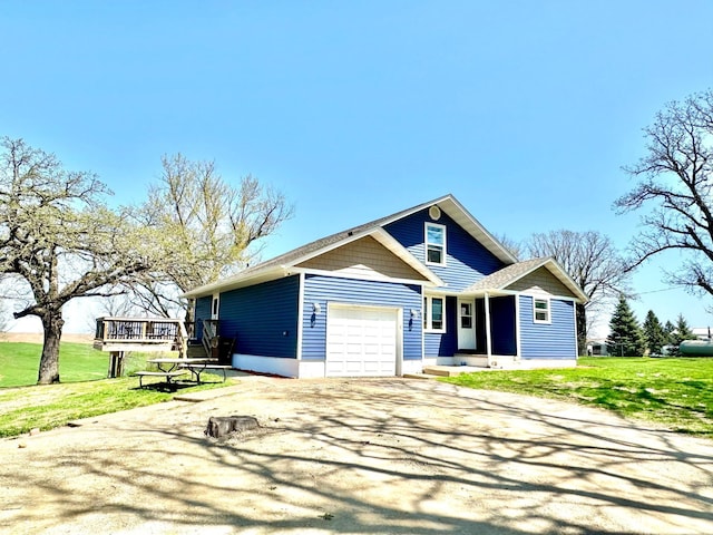 craftsman house featuring a garage, driveway, a deck, and a front yard