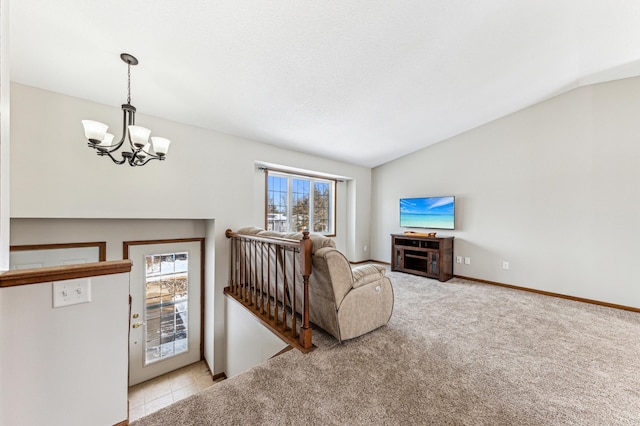 carpeted living room featuring a notable chandelier, baseboards, and lofted ceiling