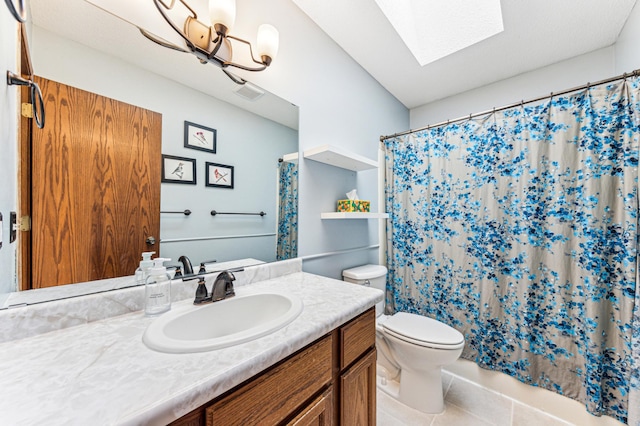 full bath with vanity, visible vents, a skylight, tile patterned flooring, and toilet