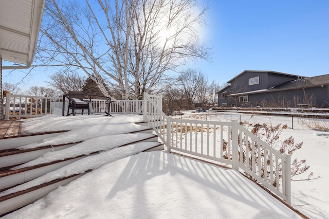 exterior space featuring a wooden deck and fence