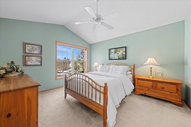 bedroom with baseboards, vaulted ceiling, light carpet, a textured ceiling, and a ceiling fan