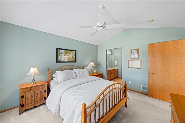 bedroom featuring vaulted ceiling, light colored carpet, visible vents, and baseboards