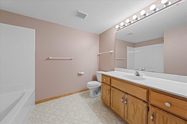 bathroom with toilet, baseboards, visible vents, and a textured ceiling