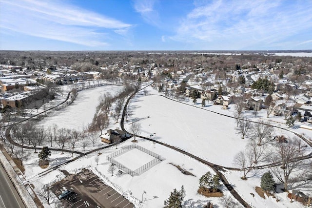 snowy aerial view featuring a residential view