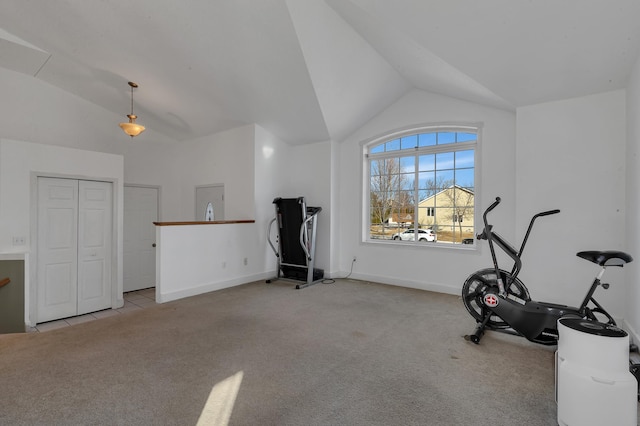 workout room featuring vaulted ceiling, carpet, and baseboards