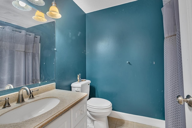 bathroom with tile patterned floors, toilet, curtained shower, baseboards, and vanity