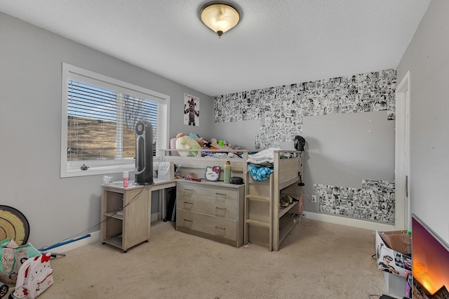 bedroom with a textured ceiling, baseboards, and light carpet