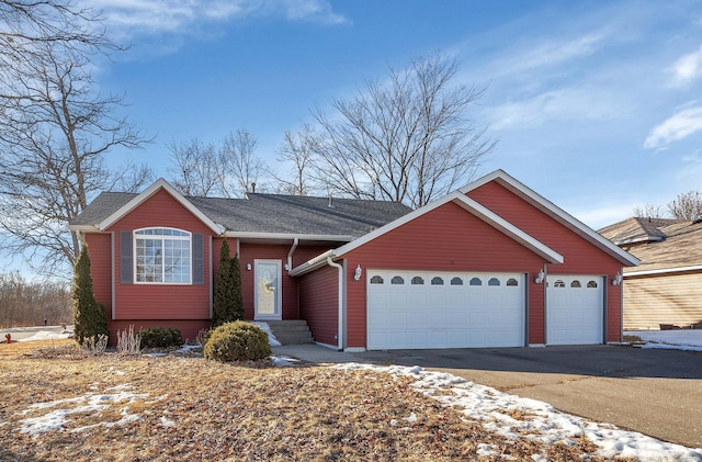 view of front of home featuring driveway and a garage