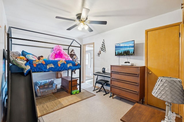 bedroom featuring light colored carpet and ceiling fan