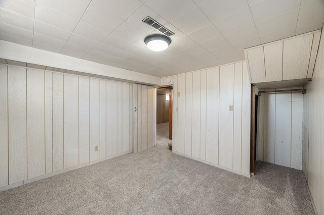 basement featuring carpet and visible vents