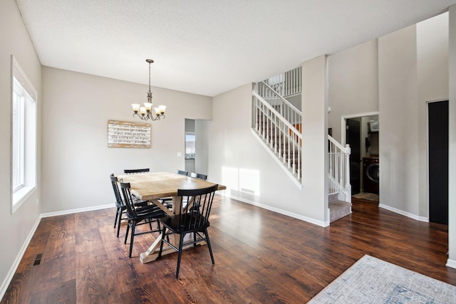 dining space featuring stairs, an inviting chandelier, wood finished floors, and baseboards