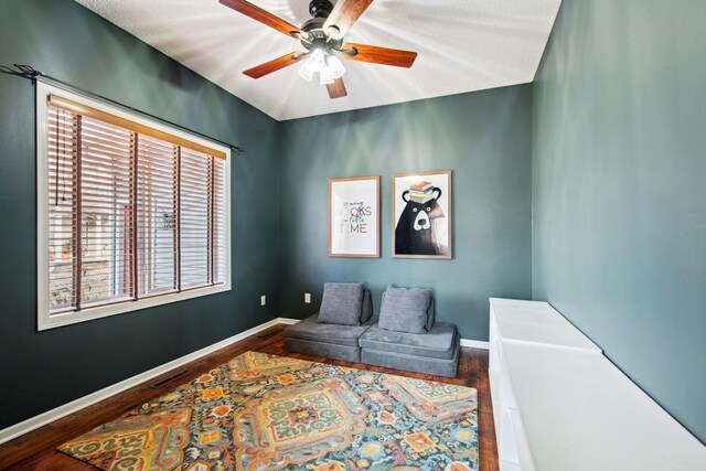 sitting room featuring dark wood finished floors, visible vents, and baseboards