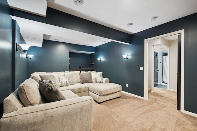 home theater with visible vents, baseboards, and carpet