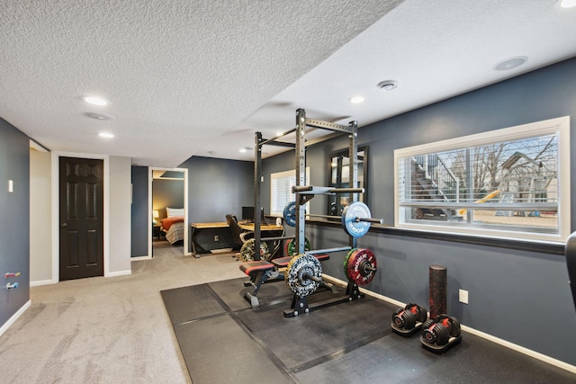 workout room with visible vents, baseboards, carpet floors, recessed lighting, and a textured ceiling