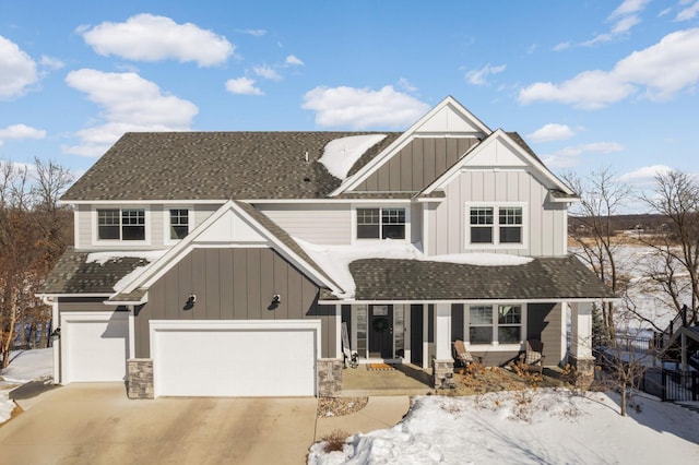 view of front of property featuring board and batten siding, a porch, driveway, and a shingled roof