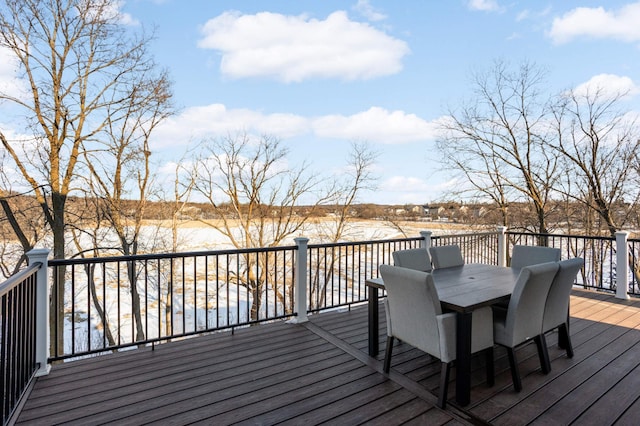 wooden deck featuring outdoor dining area