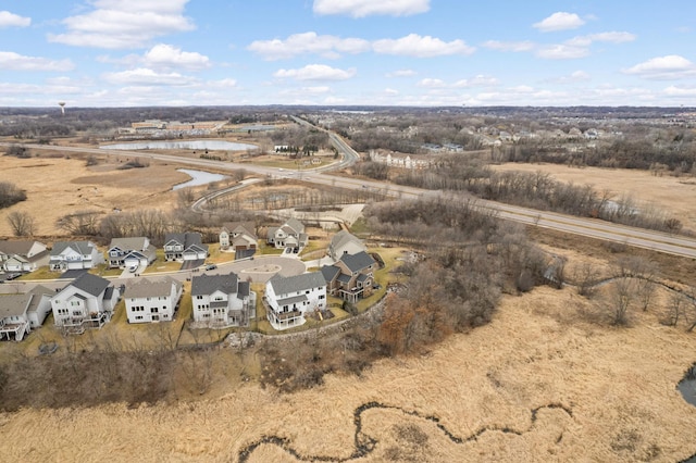 birds eye view of property featuring a residential view and a water view