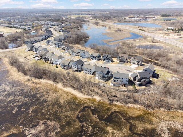 aerial view featuring a water view and a residential view