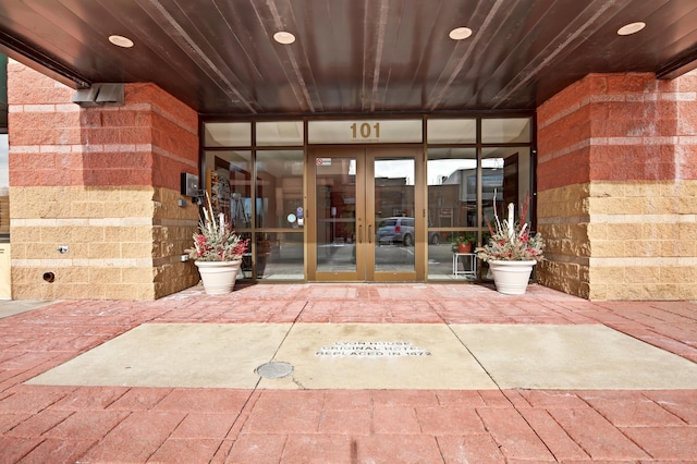 view of exterior entry featuring french doors