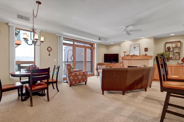 living room featuring recessed lighting, visible vents, light carpet, and ceiling fan