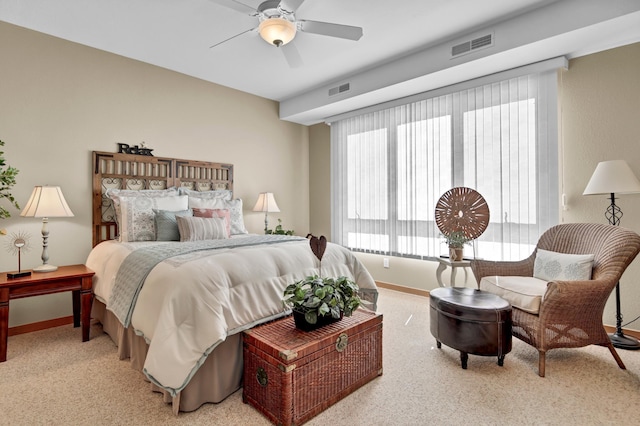 bedroom with visible vents, ceiling fan, light colored carpet, and baseboards