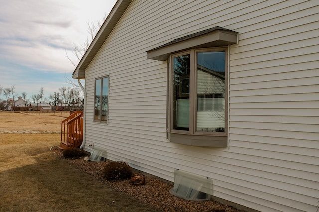 view of property exterior with crawl space