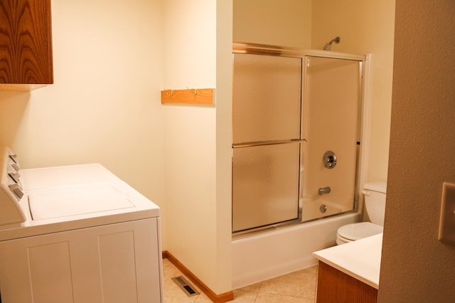 full bathroom featuring tile patterned flooring, visible vents, washer and clothes dryer, toilet, and vanity