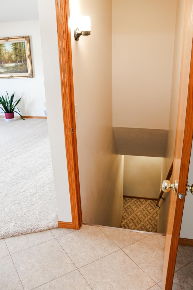 interior space with tile patterned floors and baseboards