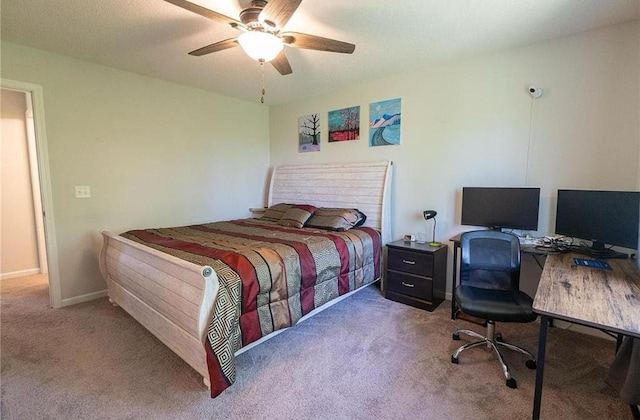 carpeted bedroom featuring ceiling fan and baseboards