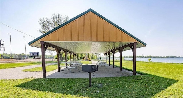 view of home's community featuring a gazebo, a lawn, and a water view