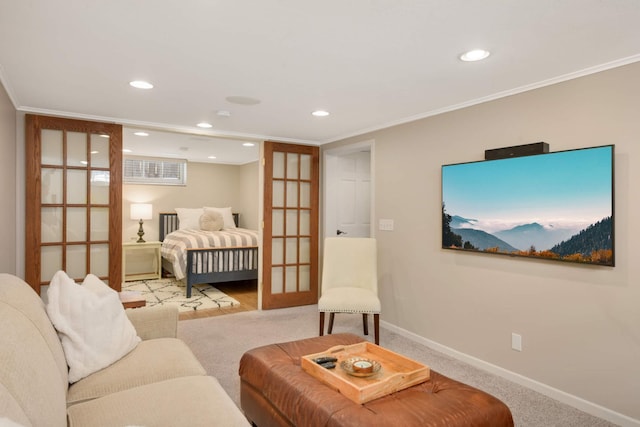 carpeted bedroom featuring recessed lighting, french doors, crown molding, and baseboards