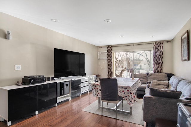 living area featuring recessed lighting, an AC wall unit, and dark wood-style floors