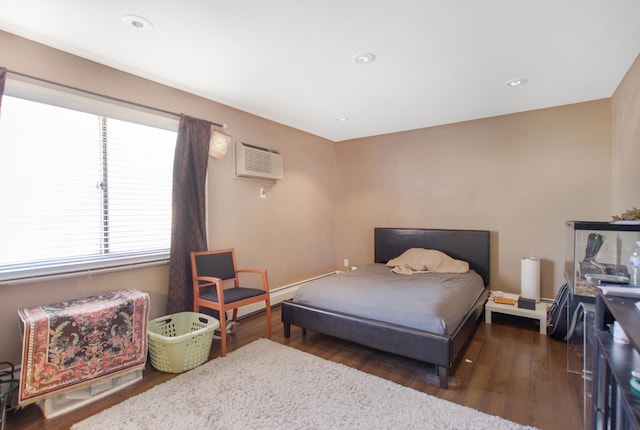 bedroom featuring dark wood-style floors, recessed lighting, a baseboard heating unit, and a wall mounted AC