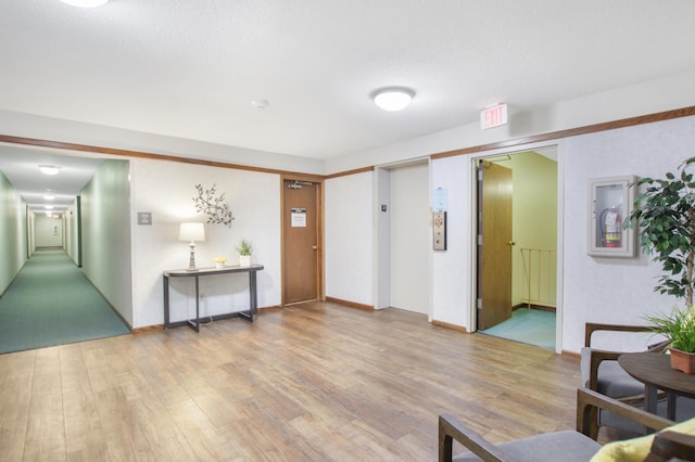 interior space featuring light wood-style flooring and elevator