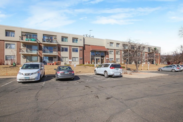 view of property featuring uncovered parking