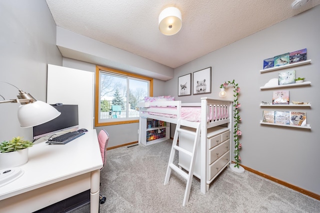 bedroom with light carpet, a textured ceiling, and baseboards