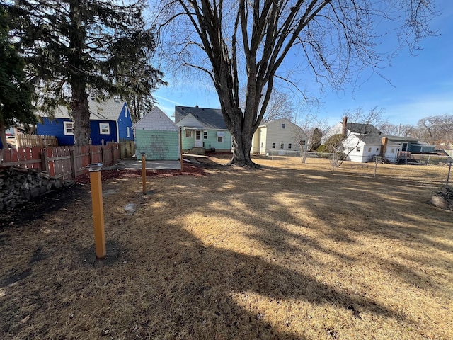 view of yard featuring a residential view and a fenced backyard