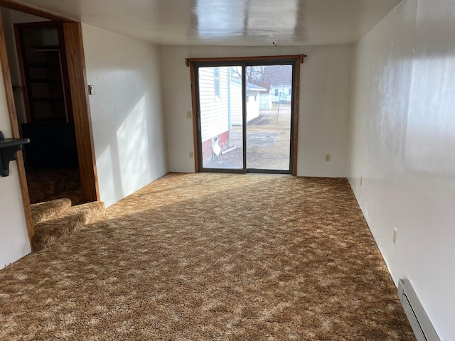 unfurnished room featuring a baseboard radiator and carpet flooring